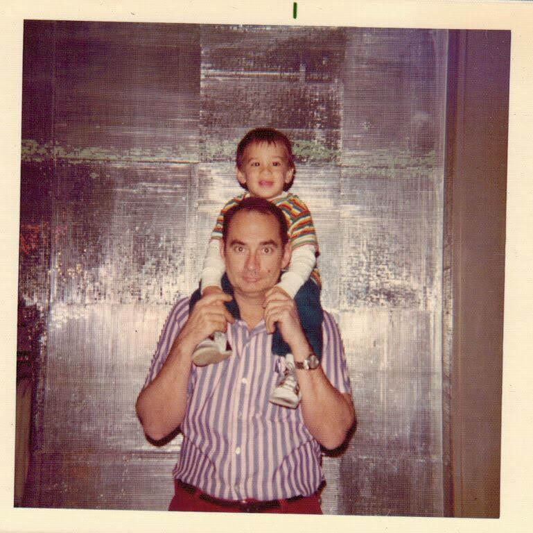 Jorge Cruise as a toddler on his father Mel's shoulders, 1973