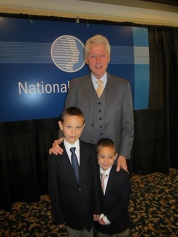 President Bill Clinton with Jorge Cruise's sons Parker and Owen in San Diego