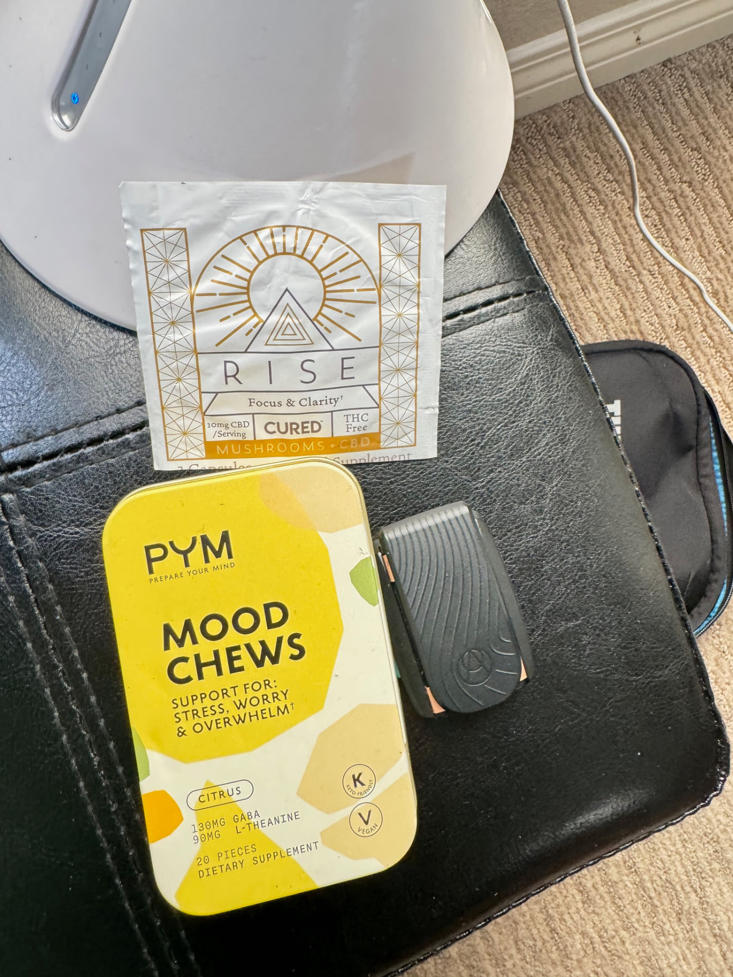 PYM Mood Chews tin beside a Rise packet