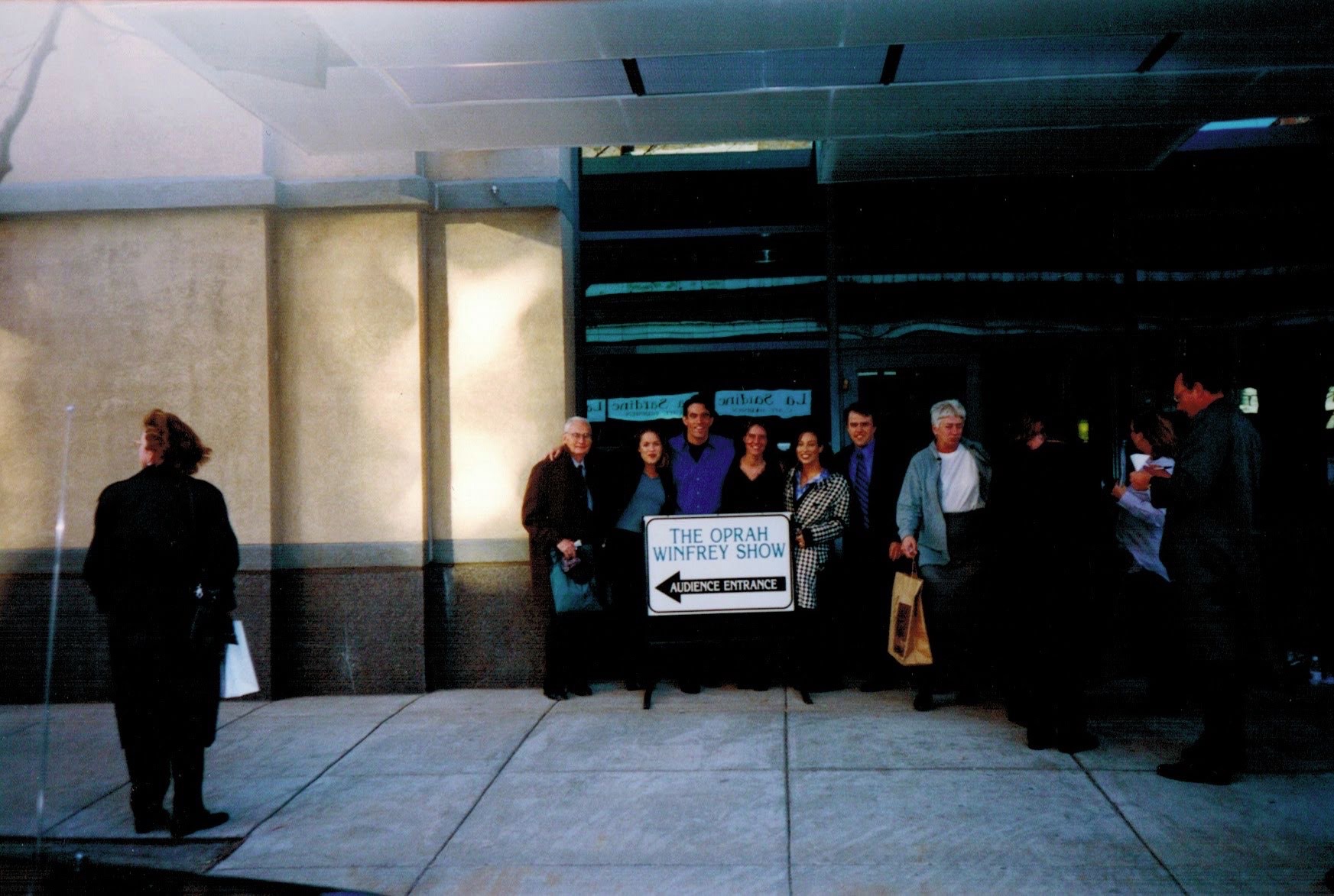 Jorge Cruise with his father and his sister Marta outside the Oprah Winfrey Show audience entrance, 1998