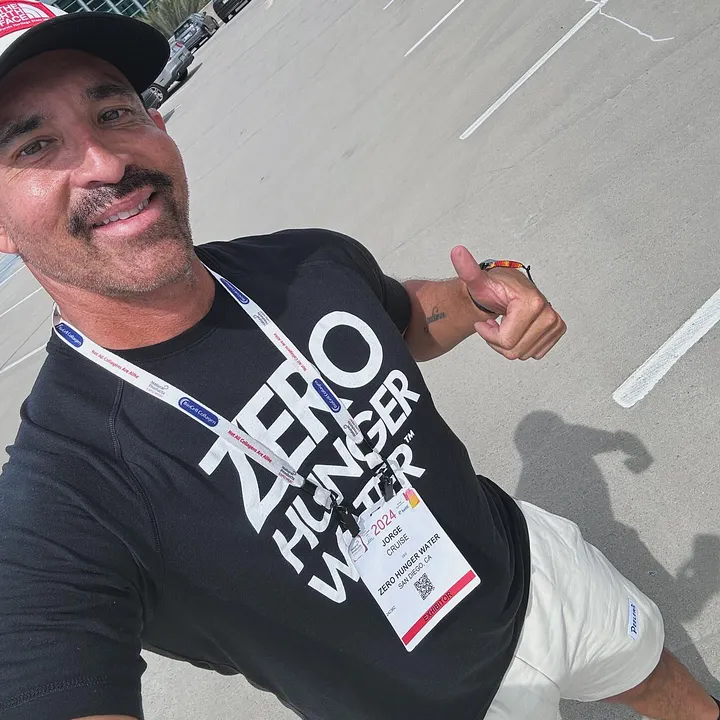 Jorge Cruise wearing his Zero Hunger Water t-shirt — 2026