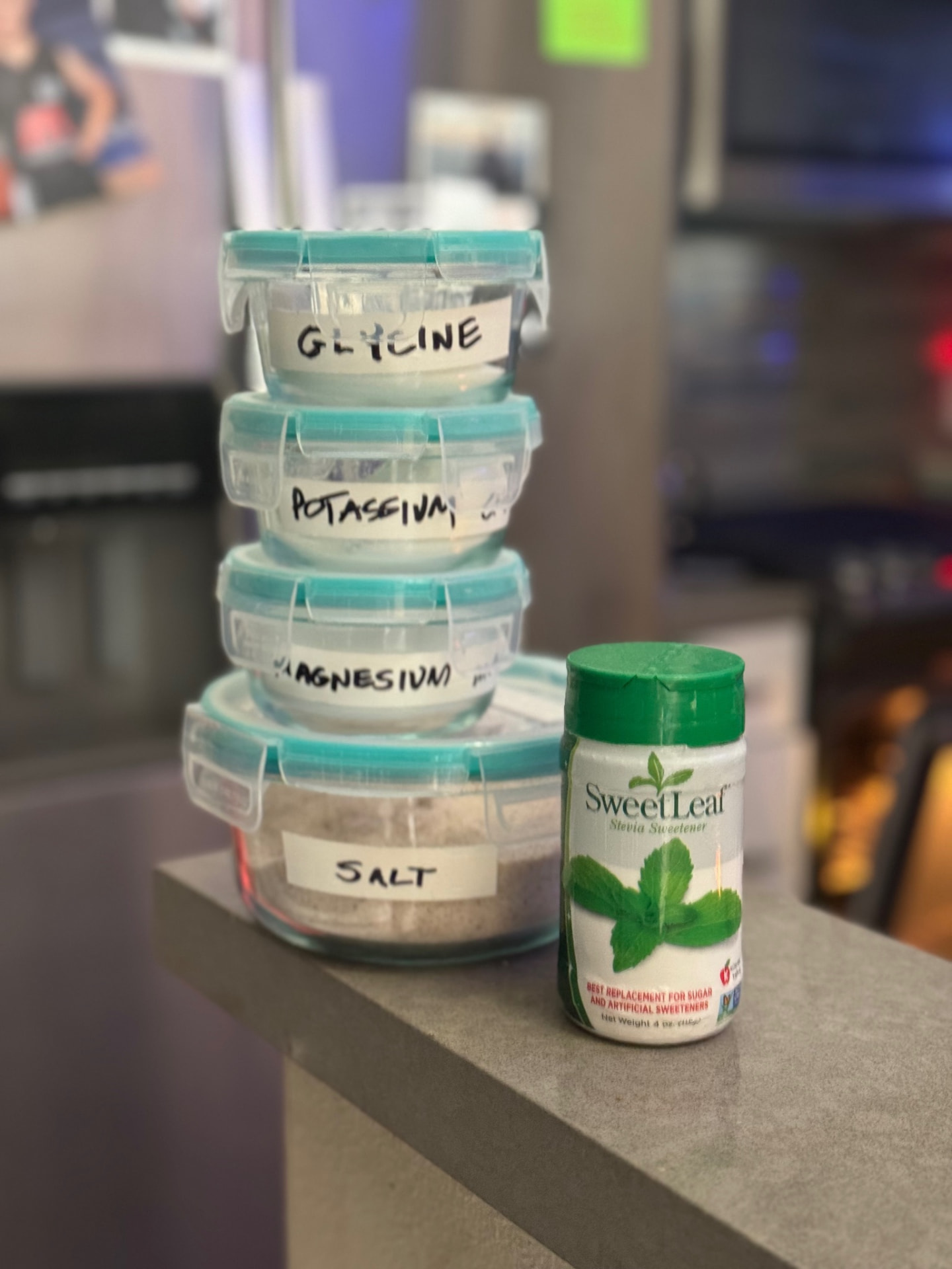 SweetLeaf stevia bottle beside jars of magnesium, potassium, glycinate and salt
