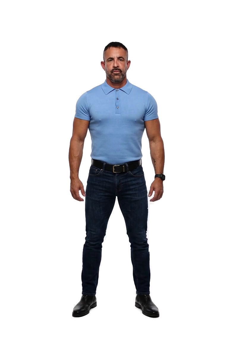 Jorge Cruise standing head to toe in a blue shirt and jeans